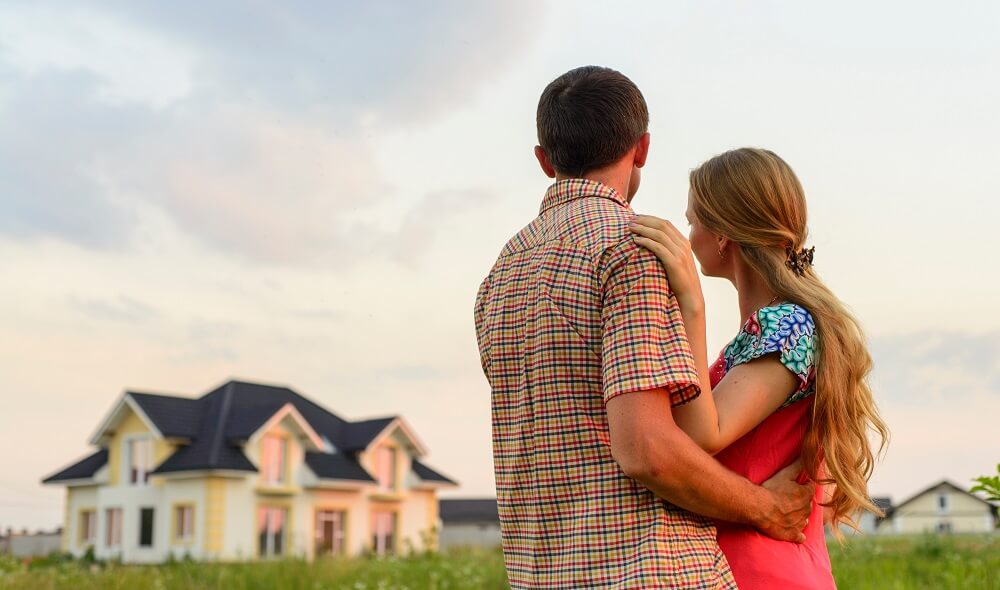 Couple looking at a house.